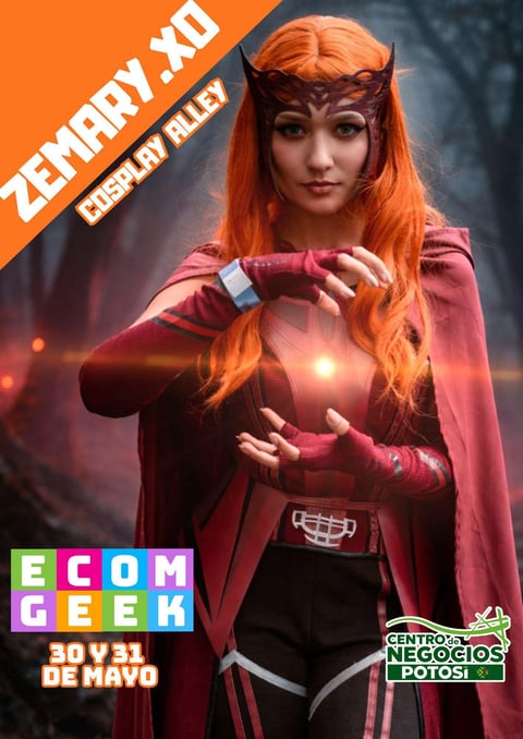 Cosplay character with orange hair wearing red cape and black outfit, glowing magical effect in hands
