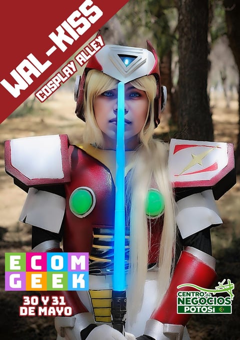 Cosplayer in futuristic robot costume with white and red armor, blue glowing chest piece, and long blonde hair at outdoor event.