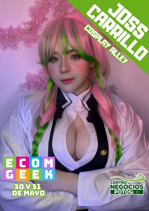 Person in cosplay costume with pink and green hair, white blazer and black vest at EcomGeek event May 30-31